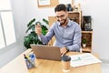 Young arab man smiling confident having video call working at office Royalty Free Stock Photo