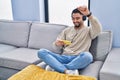 Young arab man smiling confident playing video game at home Royalty Free Stock Photo