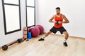 Young arab man training with kettlebell at sport center Royalty Free Stock Photo