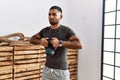 Young arab man training with kettlebell at sport center Royalty Free Stock Photo