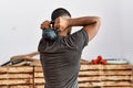 Young arab man training with kettlebell at sport center Royalty Free Stock Photo