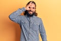 Young arab man wearing casual clothes smiling happy doing ok sign with hand on eye looking through fingers Royalty Free Stock Photo