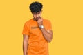 Young arab man wearing tshirt with happiness word message pointing to the eye watching you gesture, suspicious expression Royalty Free Stock Photo