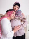 Young arab muslim family with pregnant wife expecting baby Royalty Free Stock Photo