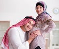 Young arab muslim family with pregnant wife expecting baby Royalty Free Stock Photo