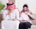 Young arab muslim family with pregnant wife expecting baby Royalty Free Stock Photo