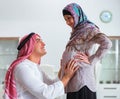 Young arab muslim family with pregnant wife expecting baby Royalty Free Stock Photo