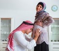 Young arab muslim family with pregnant wife expecting baby Royalty Free Stock Photo