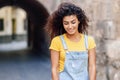 Young Arab woman with curly hairstyle outdoors. Royalty Free Stock Photo