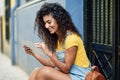 Young Arab woman using her digital tablet outdoors Royalty Free Stock Photo