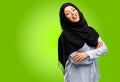 Young arab woman wearing hijab isolated over green background Royalty Free Stock Photo