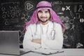 Young Arabian doctor with laptop in the lab