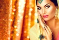 Young arabian woman with mehndi tattoo and perfect make-up