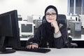 Young Arabian worker smiling in office