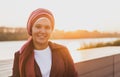 Young Arabic muslim woman in hijab walking at street seafront copy space and place for advertising