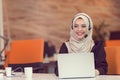 Young Arabic business woman wearing hijab,working in her startup office. Royalty Free Stock Photo