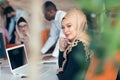 Young Arabic business woman wearing hijab,working in her startup office. Royalty Free Stock Photo