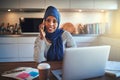 Young Arabic female entrepreneur talking on a cellphone at home Royalty Free Stock Photo