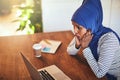 Arabic female entrepreneur looking shocked while working online Royalty Free Stock Photo