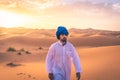 Young arabic man wearing traditional berber clothes in the Sahara Desert of Merzouga, Morocco Royalty Free Stock Photo