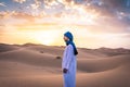 Young arabic man wearing traditional berber clothes in the Sahara Desert of Merzouga, Morocco Royalty Free Stock Photo