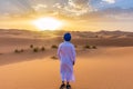 Young arabic man wearing traditional berber clothes in the Sahara Desert of Merzouga, Morocco Royalty Free Stock Photo