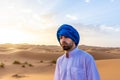 Young arabic man wearing traditional berber clothes in the Sahara Desert of Merzouga, Morocco Royalty Free Stock Photo