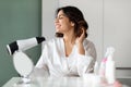 Young Arabic Woman Drying, Styling Hair Using Hairdryer At Home Royalty Free Stock Photo