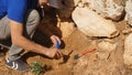 Young archeologist works on an archaeological site