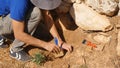 Young archeologist works on an archaeological site