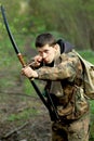 Young archer in forest