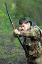 Young archer in forest