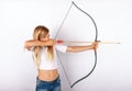 Young girl targeting with bow and arrow