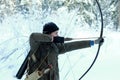 Young archer in winter snow forest Royalty Free Stock Photo