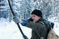 Young archer in winter snow forest Royalty Free Stock Photo