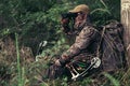 Archery hunter scouting for his next target.