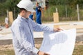 Young architect checking a structural drawing Royalty Free Stock Photo
