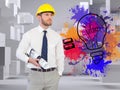 Young architect posing with hard hat and plan