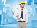 Young architect posing with hard hat and plan