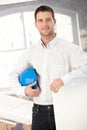 Young architect smiling in office