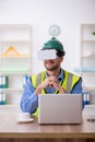 Young male architect wearing virtual glasses