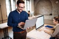 Young architect working on computer in office Royalty Free Stock Photo