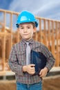 Young arhitect with helmet. Man using laptop with house in background Royalty Free Stock Photo