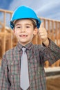 Young arhitect with helmet.showing thumb up Royalty Free Stock Photo