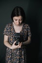 young armenian ukrainian woman making photos with vintage camera Royalty Free Stock Photo