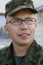 Young army cadet with glasses Royalty Free Stock Photo