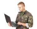 Young army soldier with a laptop Royalty Free Stock Photo