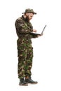 Young army soldier wearing camouflage uniform isolated on white Royalty Free Stock Photo