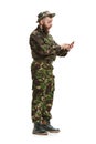 Young army soldier wearing camouflage uniform isolated on white Royalty Free Stock Photo