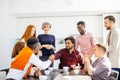 Young arrogant intern Hindoo employee is shaking hands with co-workers Royalty Free Stock Photo